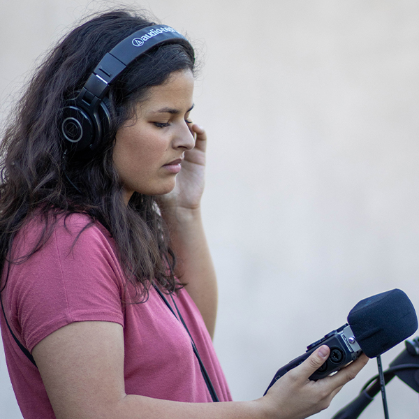 a young woman with headphones and a microphone