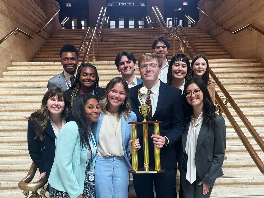 image of Rhodes College Mock Trial A Team holding trophy