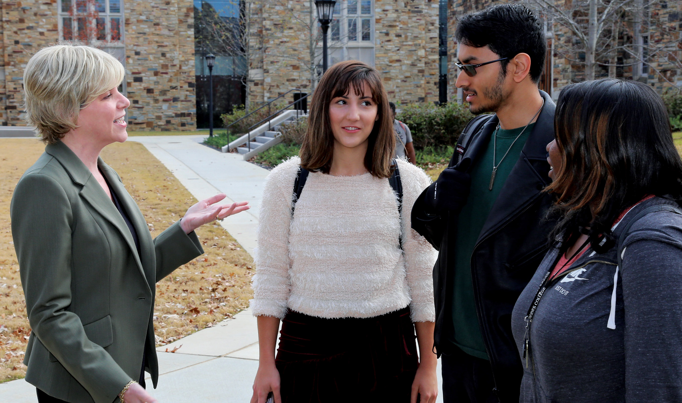 President Hass talks with students in Troutt Quad.