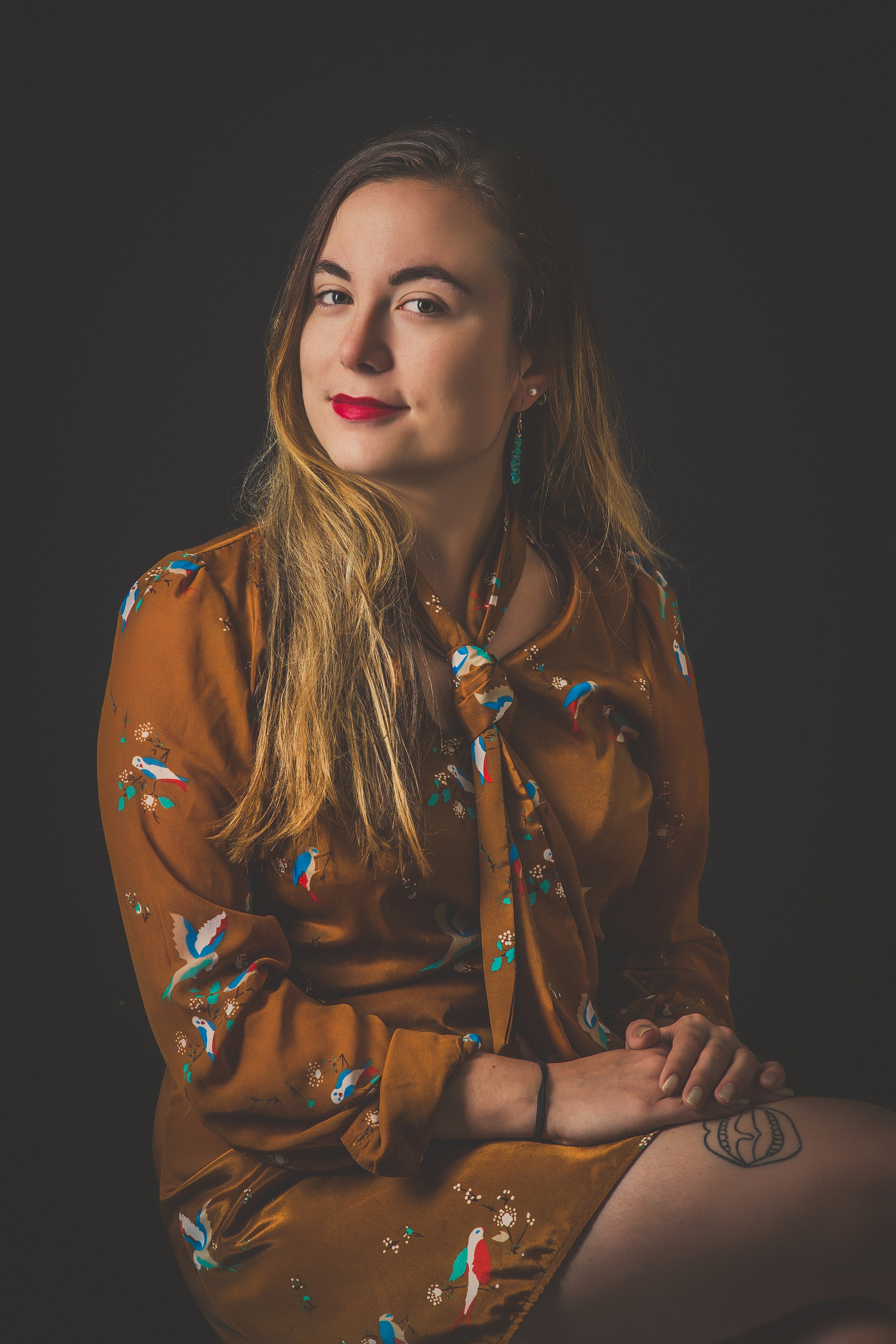 Portrait of a woman with red lipstick with a black background