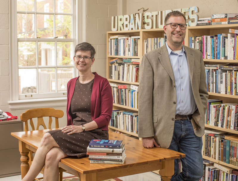 a female and male professor in an office