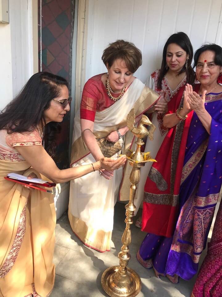 Carlson with a group of Indian women in New Delhi