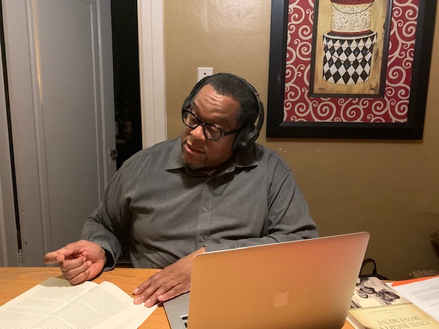 An African American man with headphones