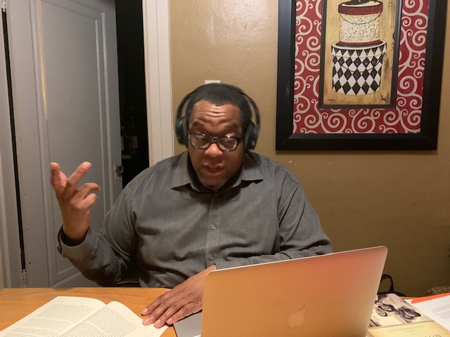 An African American man with headphones