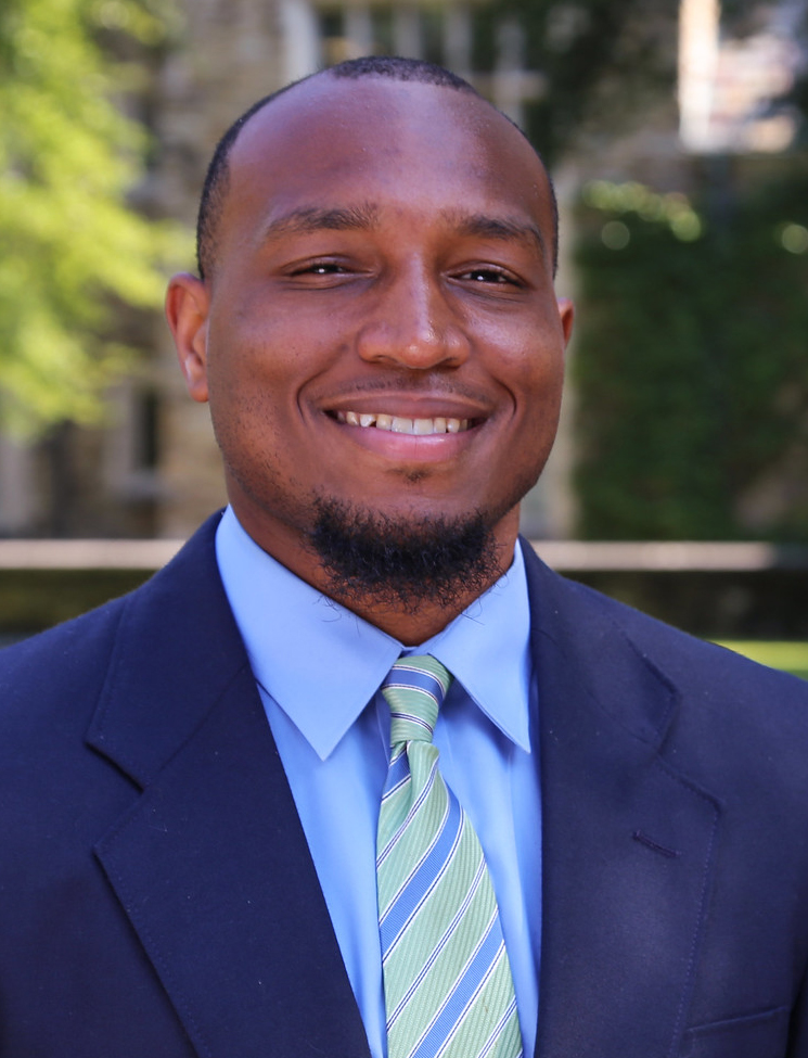 a young African American man in a blue suit