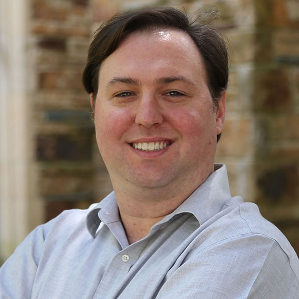 a man in a light blue shirt