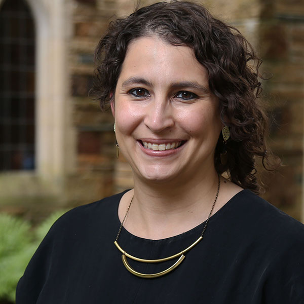 a woman with curly dark hair