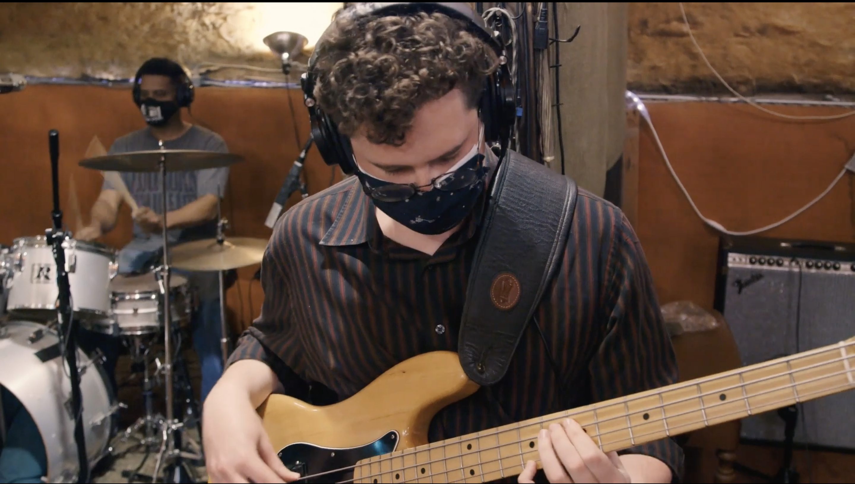 a male student plays the guitar