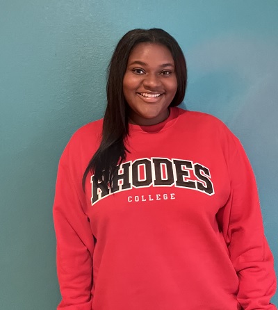 image of student Kaydence White wearing a red Rhodes College sweat shirt