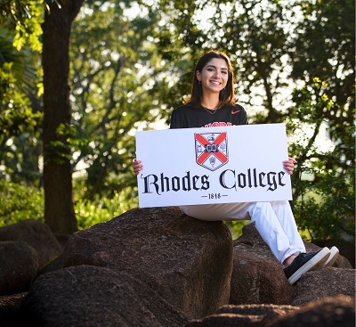 image of student Sophia Zamora holding a Rhodes College sign