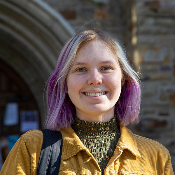 a young woman with streaked purple and blonde hair