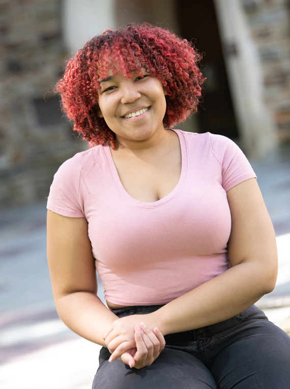 a young African American woman with red hair