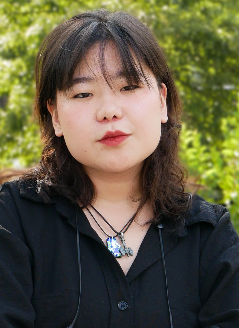 a young Mongolian woman with shoulder-length black hair