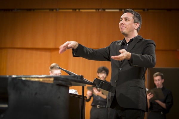 image of Jason Bishop conducting a performance