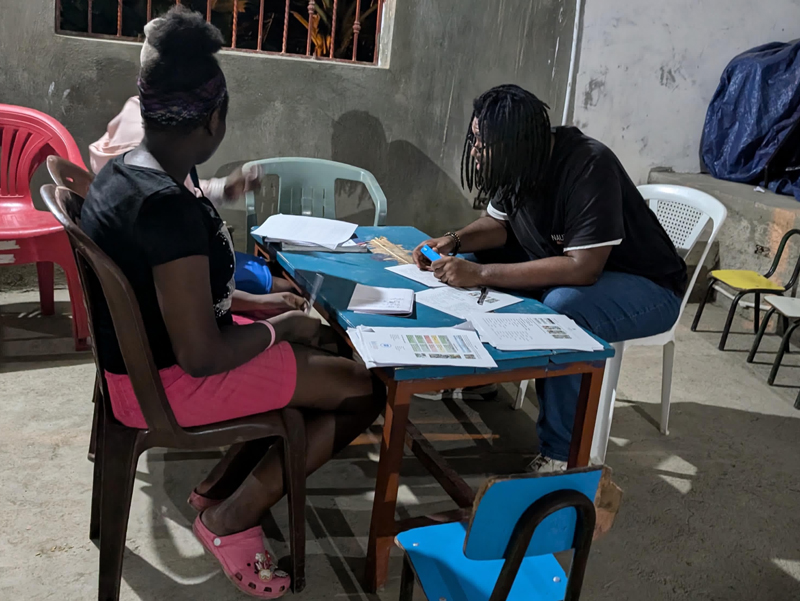 Marcus Gray volunteering as a teaching assistant to two young people in Santiago