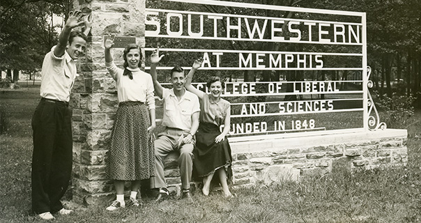 1950s students wave in front of a sign that says Southwestern
