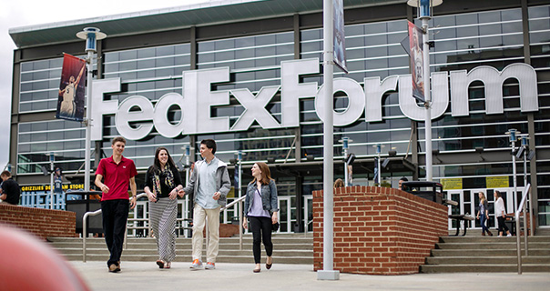 students walk in front of the FedEx Forum