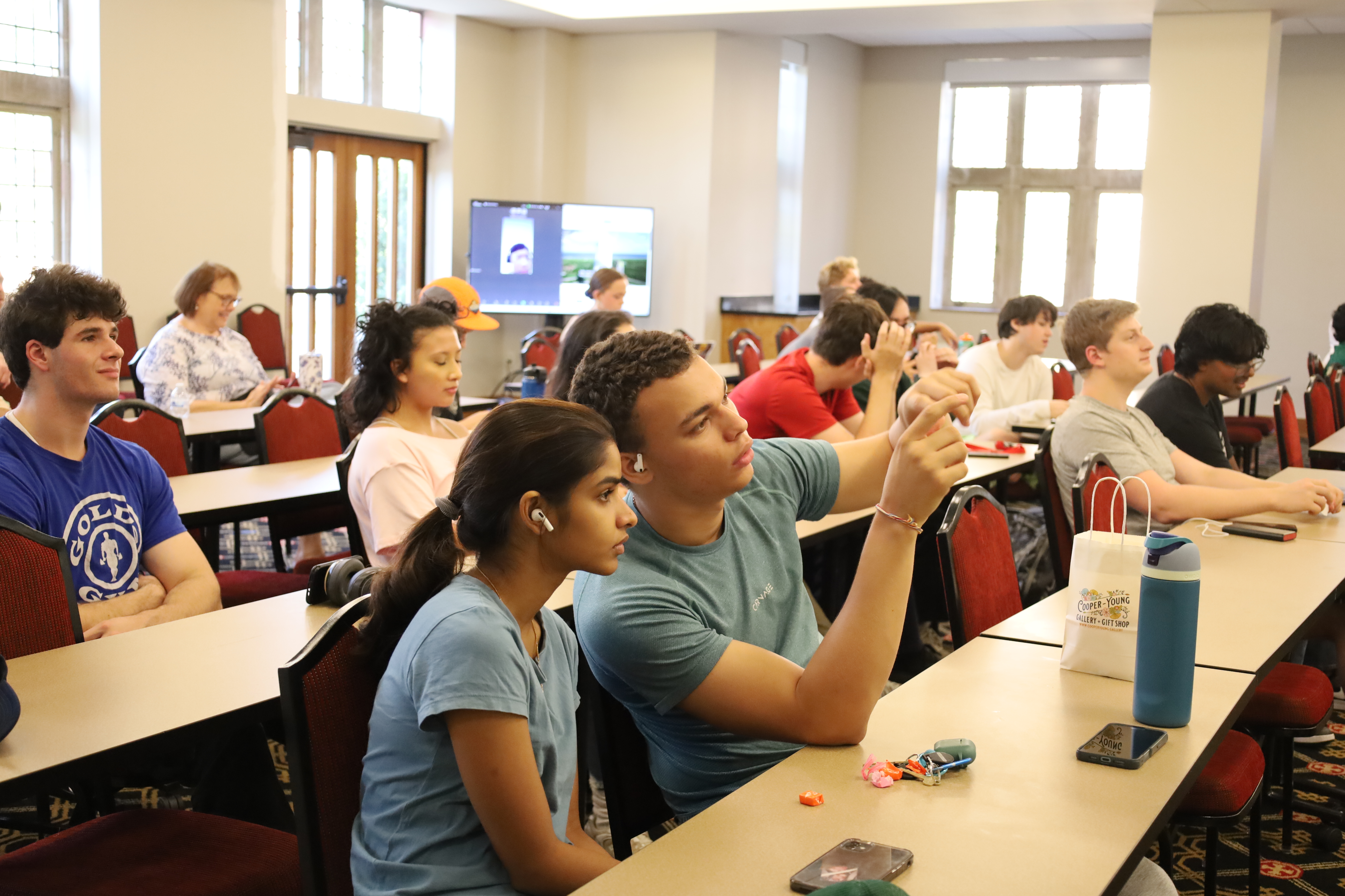 students gather to watch the launch of the satellite