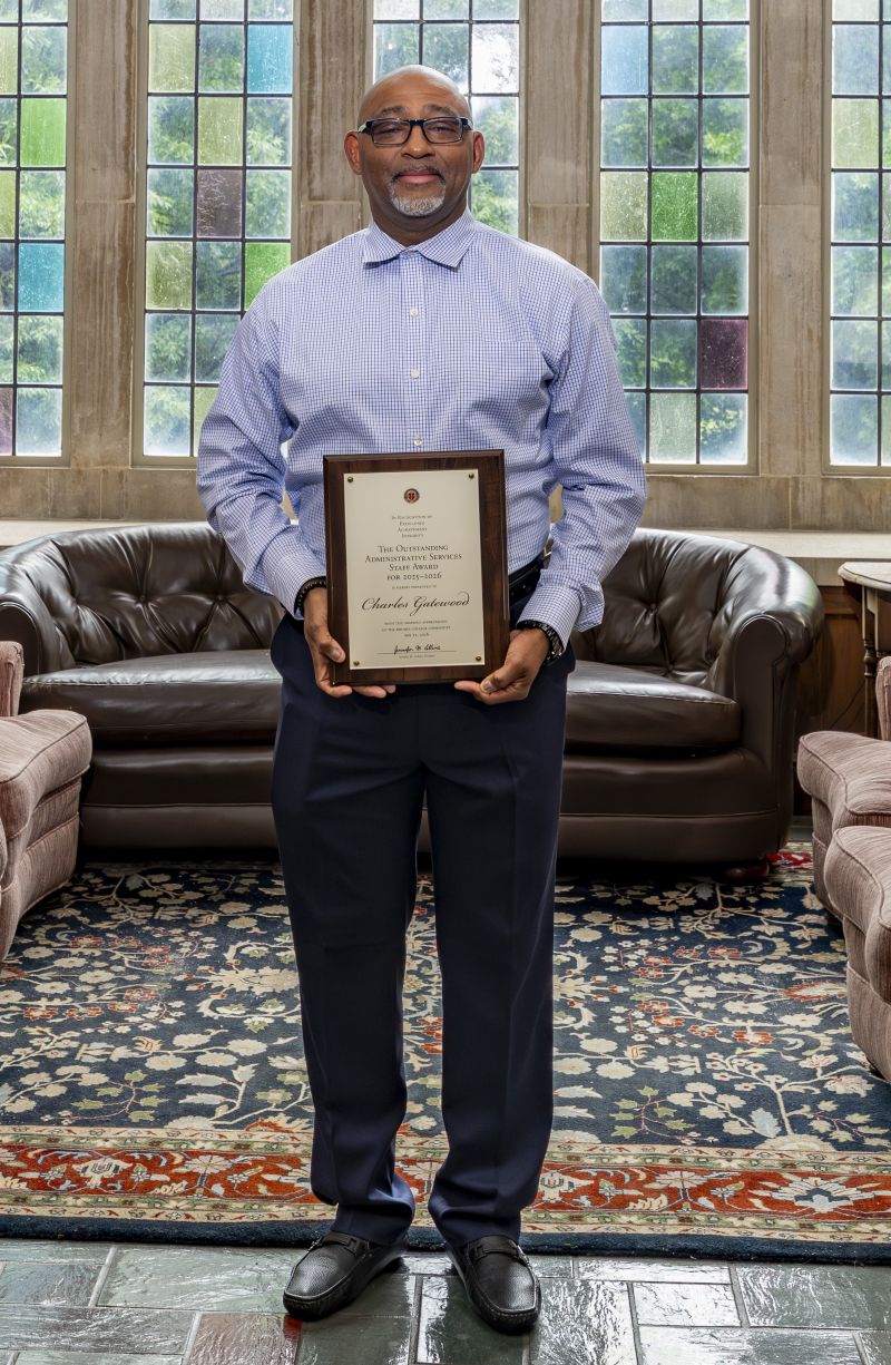 Charles Gatewood holding a plaque