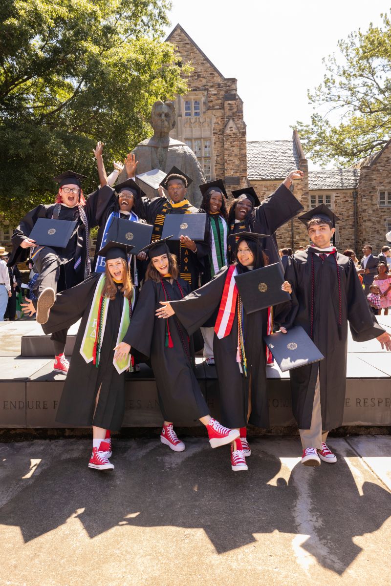 group image of Rhodes College graduates wearing red sneakers