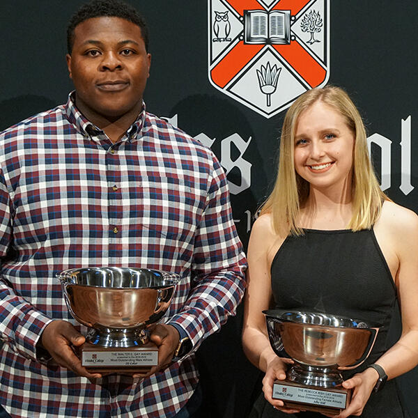 DJ Coker and Ali Hamilton holding their Gay awards