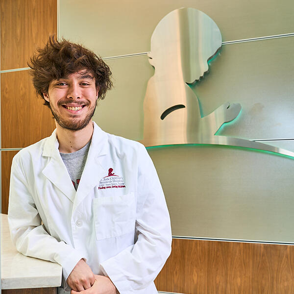  a young man in a lab coat 