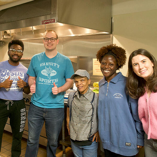 Malcolm Oliver ’26, Bion Cashio ’25, St. John’s caretaker Rose Holmes, Jayon Hodge Shaw ’27, and Suzanne Baxter ’25