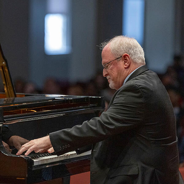 A man plays the piano