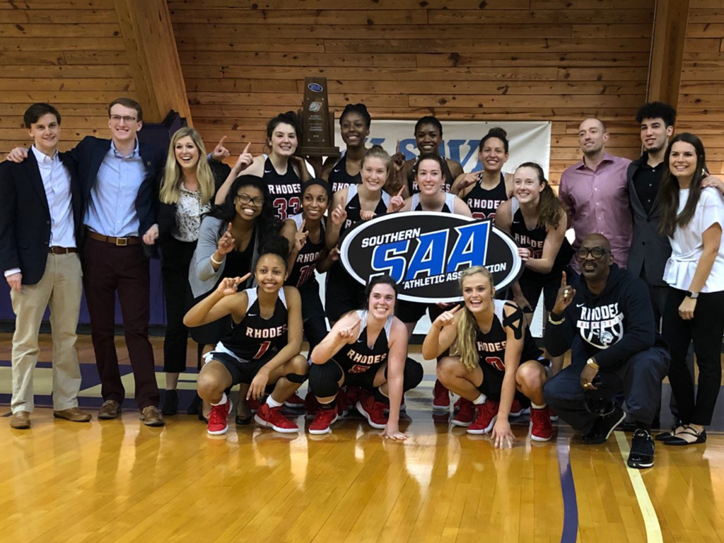 The Women's Basketball Team poses with their SAA Tournament Trophy