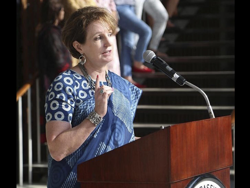 MaryKay carlson at a podium