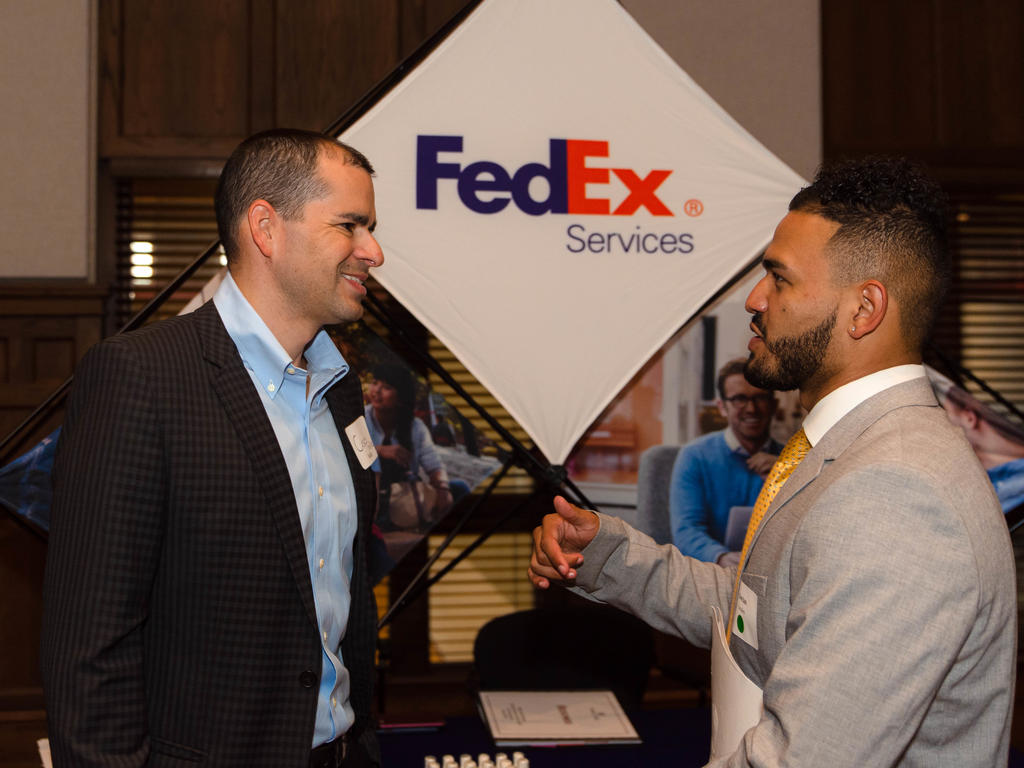 student engaging with a recruiter at a career fair