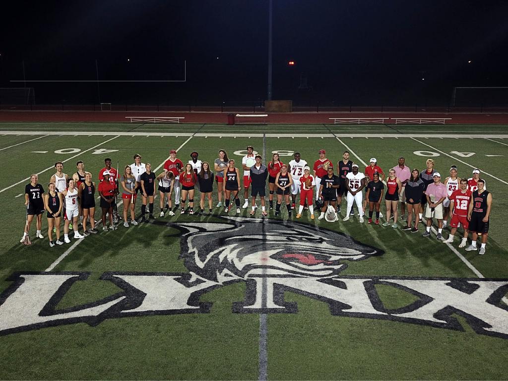 student athletes standing on a field