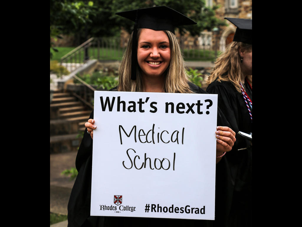 student holding medical school sign