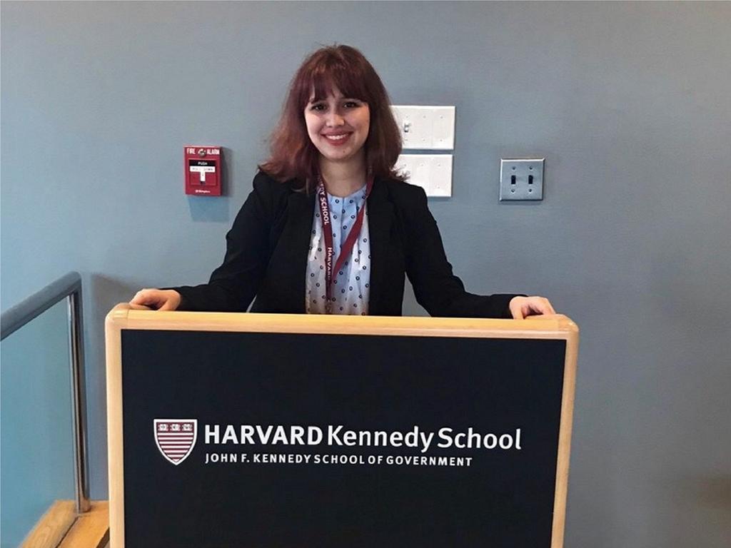 student standing at a podium