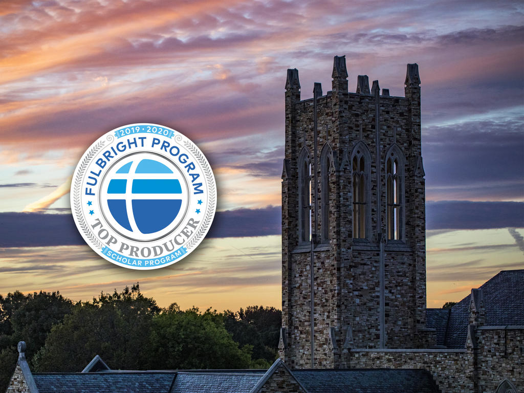 badge embedded on photo of a college campus tower against colorful sky