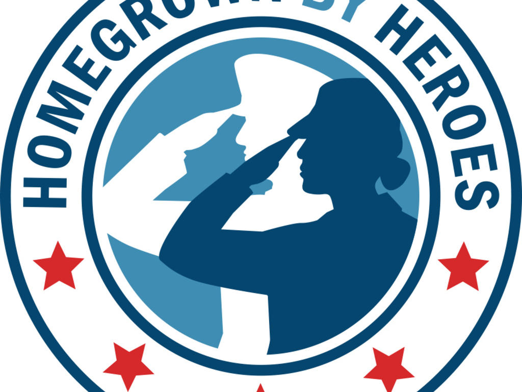 A circular logo with a man and woman saluting in silhouette surrounded by the words "Homegrown By Heroes"