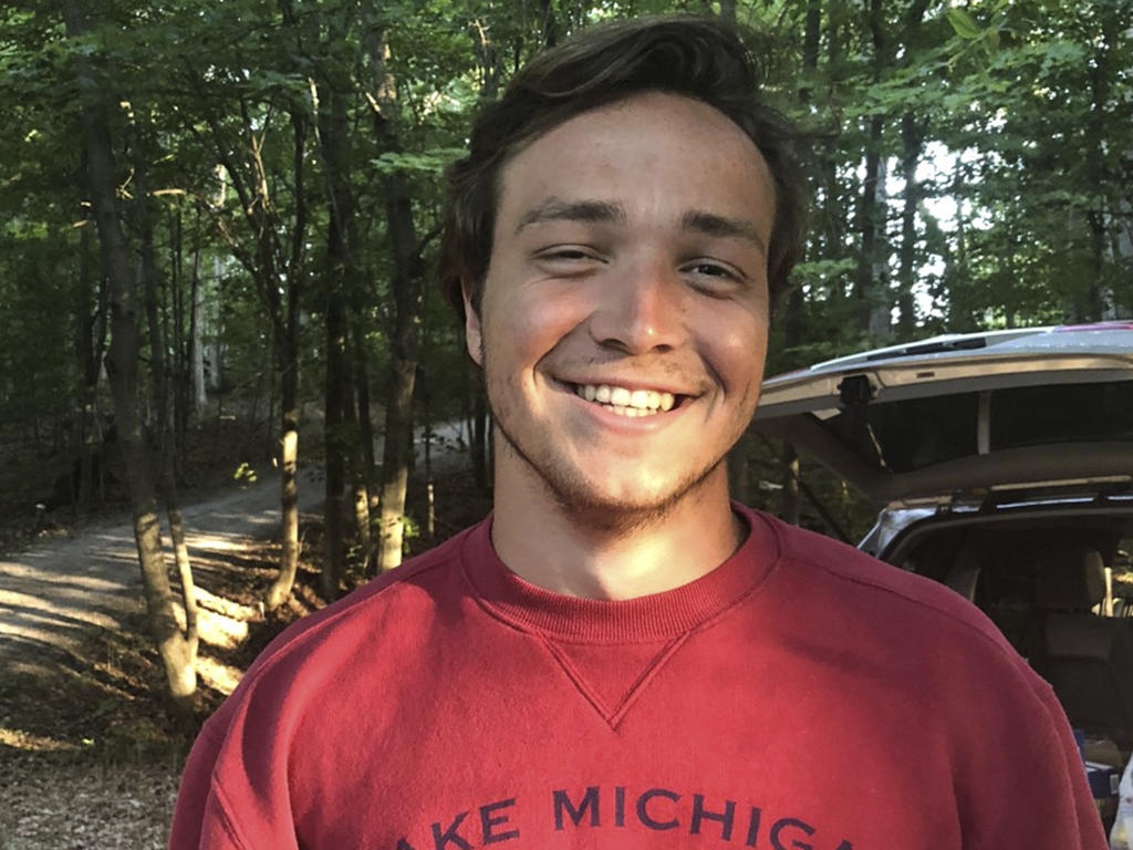 a young man in a red shirt 