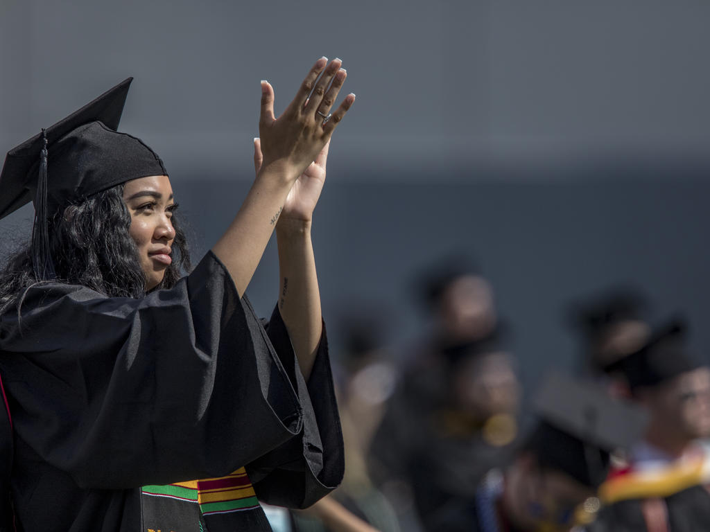 a student with graduation robes