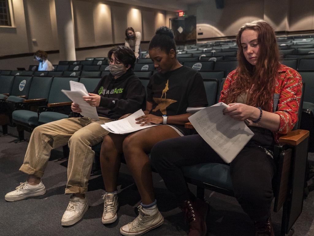 students reading theater scripts