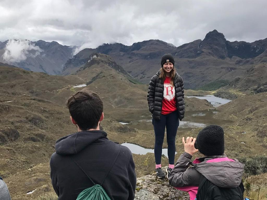 image of Rhodes College students standing among the mountains of Ecuador