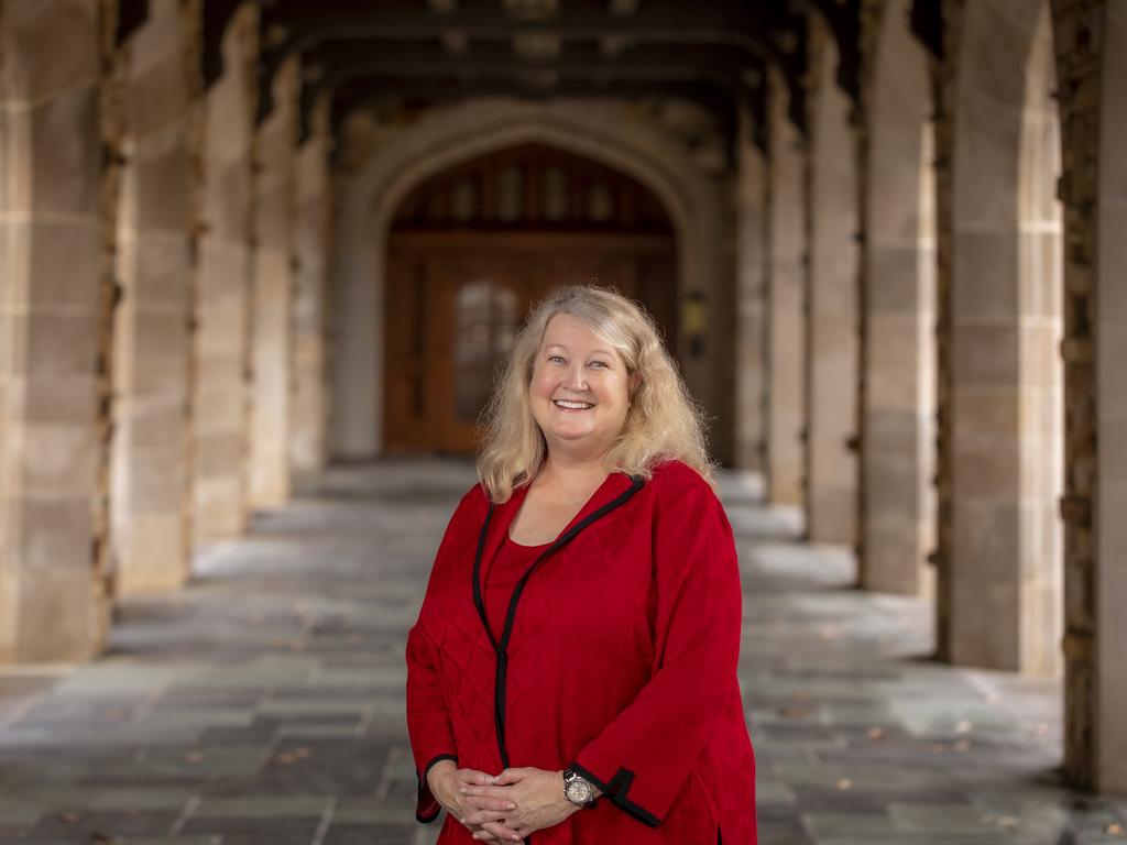 image of Rhodes College President standing outside of the library on campus