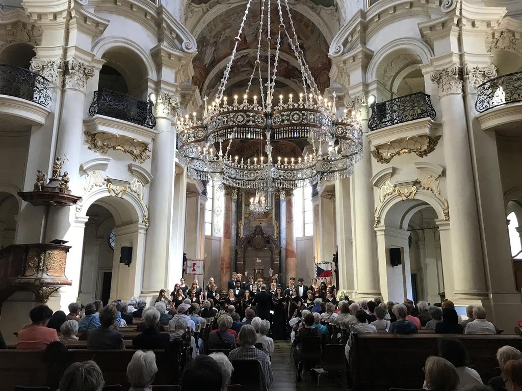 Rhodes College choral tours performing in a beautiful church