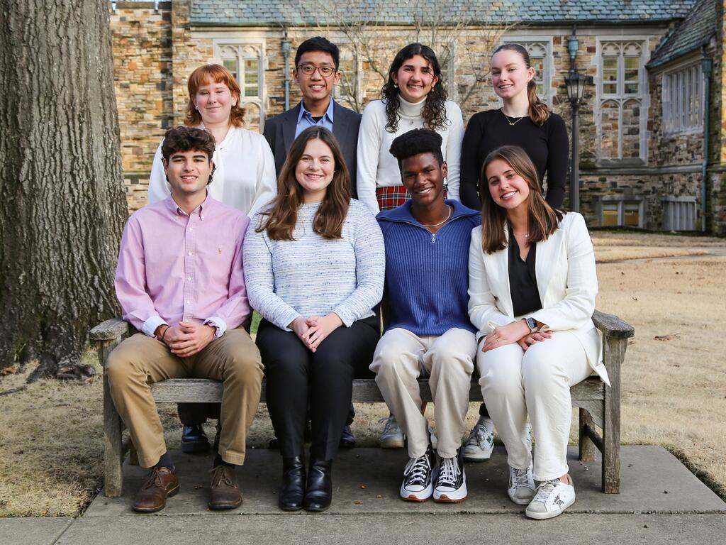 group of Rhodes College students sitting outside 