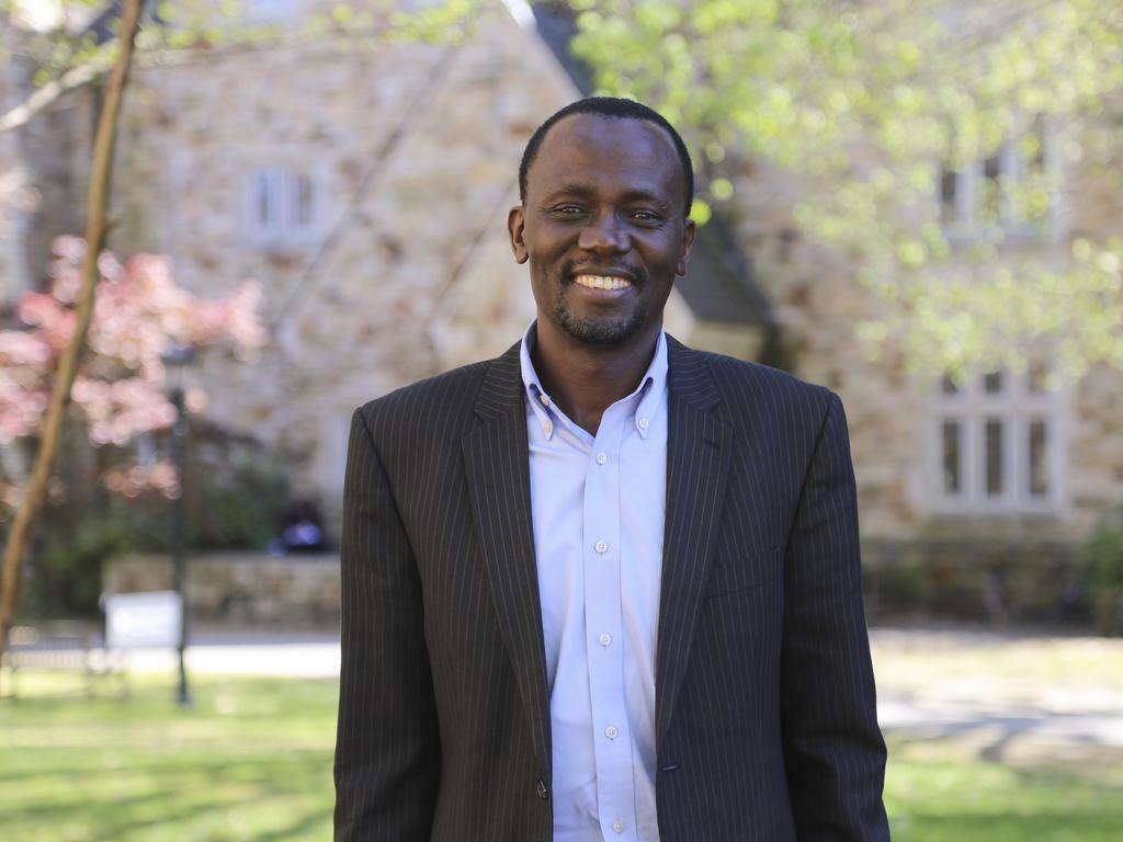 Rhodes College professor Shadrack Nasong’o standing in front of a campus building