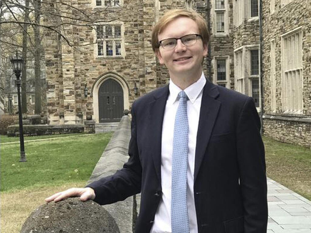 image of college student Ben Oelkers standing outside the Rhodes College campus