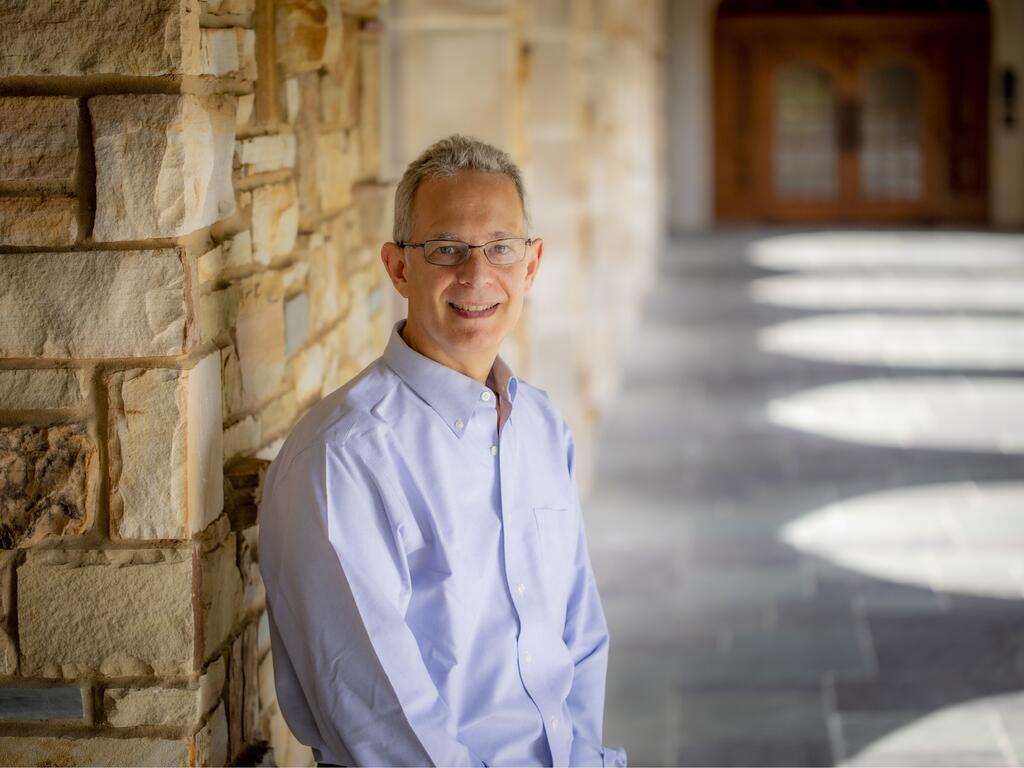 image of Professor Coonin standing outside on the Rhodes College campus