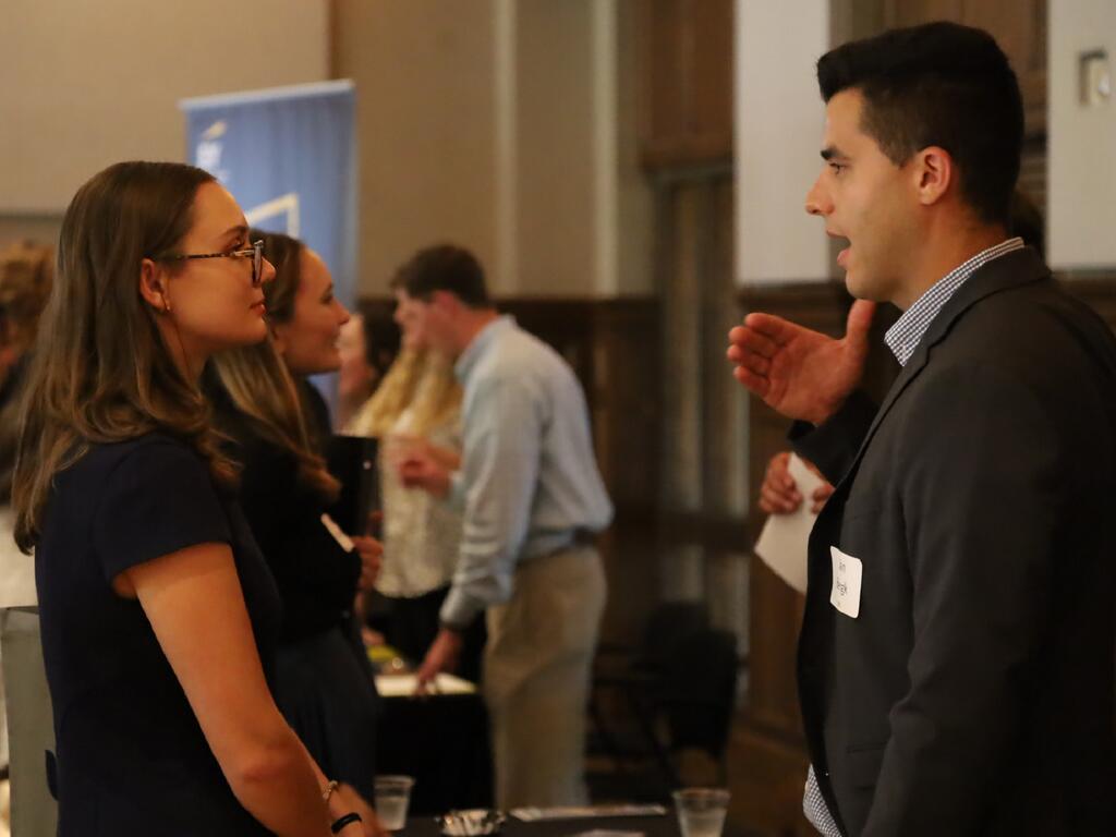 image of Meet the Firm attendee speaking with a company representative