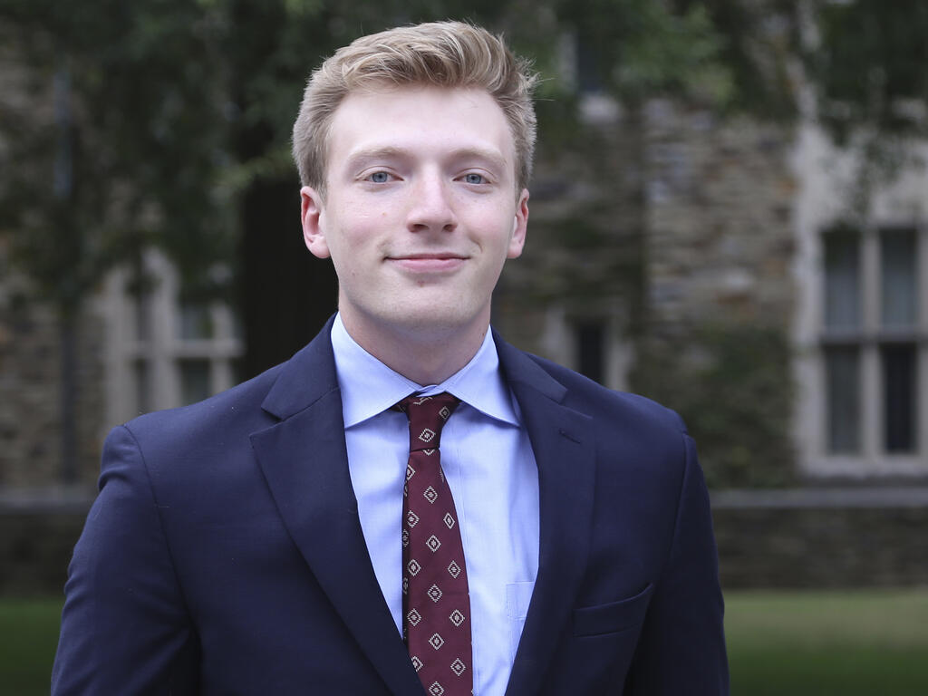 a young man in a suit and tie