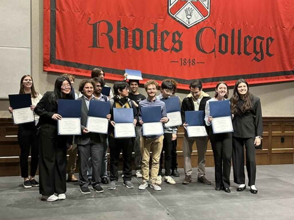 image of Rhodes College group holding certificates