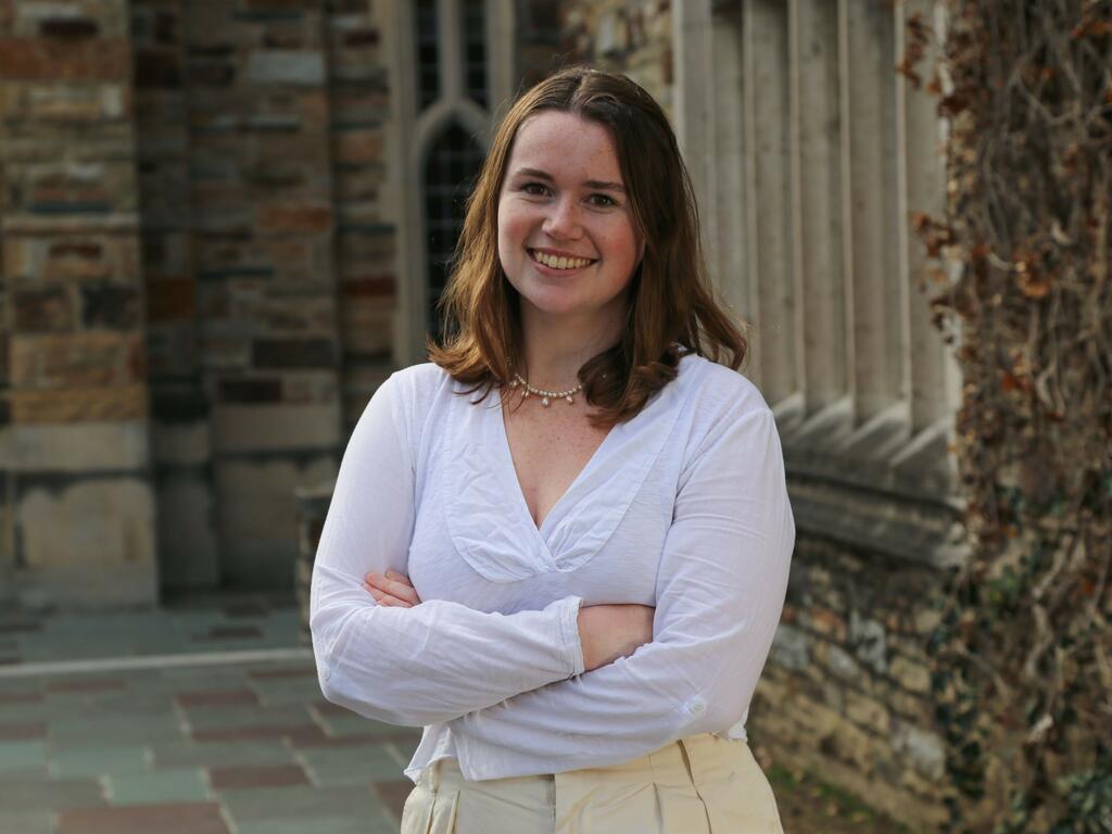 image of Rhodes College student Brooke Taylor standing outside on campus